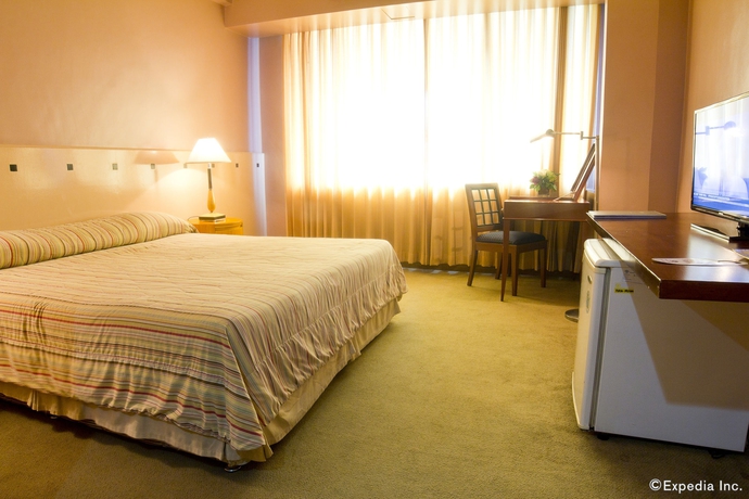 Imagen de la habitación del Hotel The Pearl Manila. Foto 3