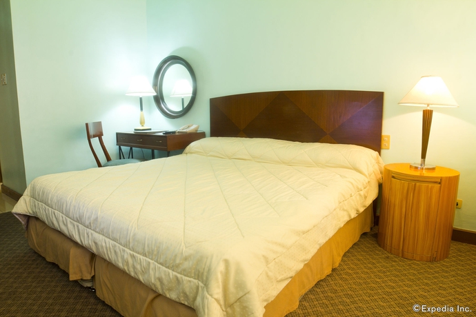 Imagen de la habitación del Hotel The Pearl Manila. Foto 10