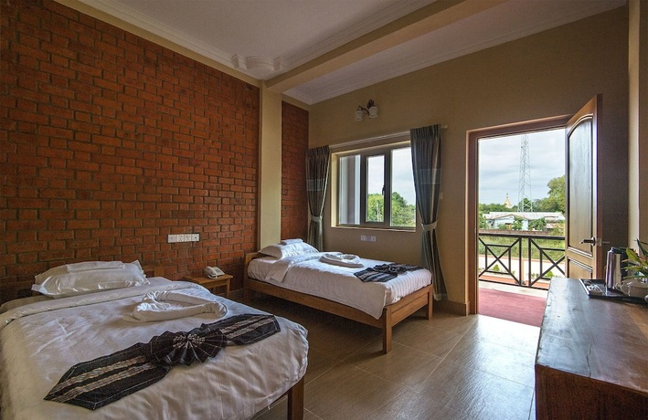 Imagen de la habitación del Hotel The Pegu Lodge. Foto 17