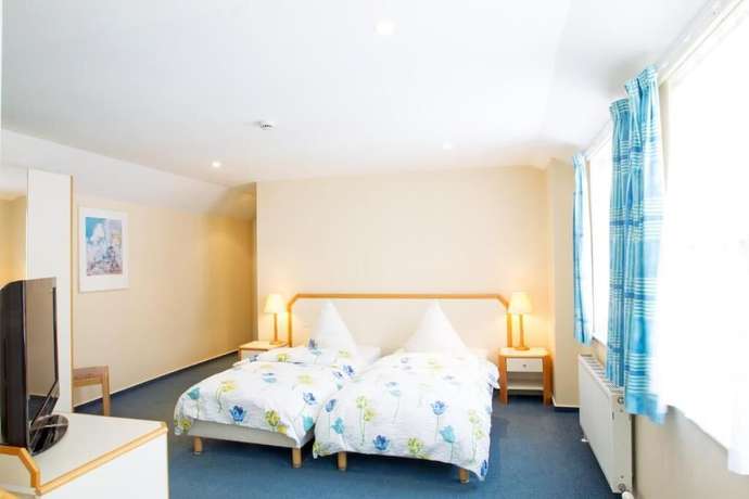 Imagen de la habitación del Hotel The Penta. Foto 6