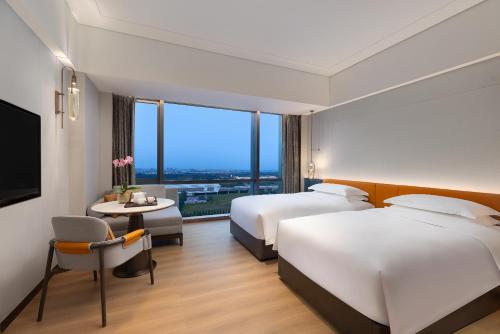 Imagen de la habitación del Hotel The Perennial Tianjin, A Jdv By Hyatt. Foto 12