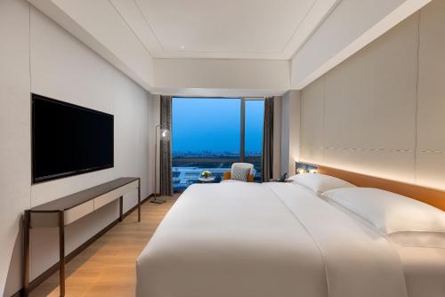 Imagen de la habitación del Hotel The Perennial Tianjin, A Jdv By Hyatt. Foto 13