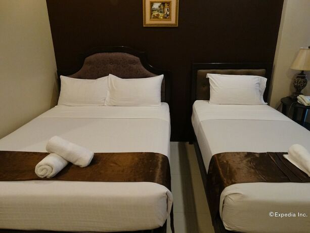 Imagen de la habitación del Hotel The Peridot Suites. Foto 2