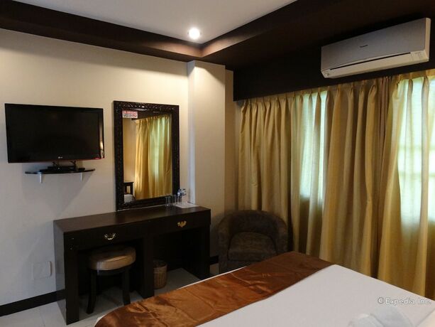 Imagen de la habitación del Hotel The Peridot Suites. Foto 3