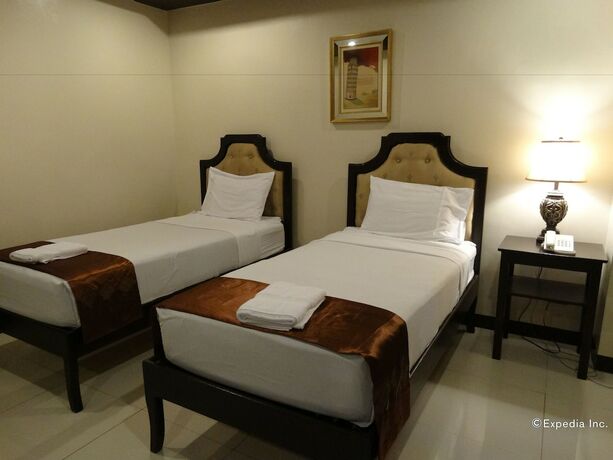 Imagen de la habitación del Hotel The Peridot Suites. Foto 4