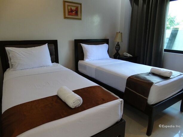 Imagen de la habitación del Hotel The Peridot Suites. Foto 5