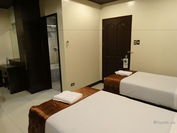 Imagen de la habitación del Hotel The Peridot Suites. Foto 6