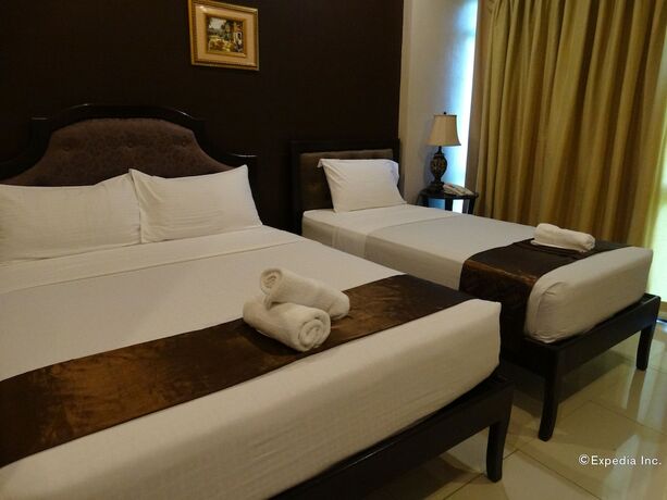 Imagen de la habitación del Hotel The Peridot Suites. Foto 8