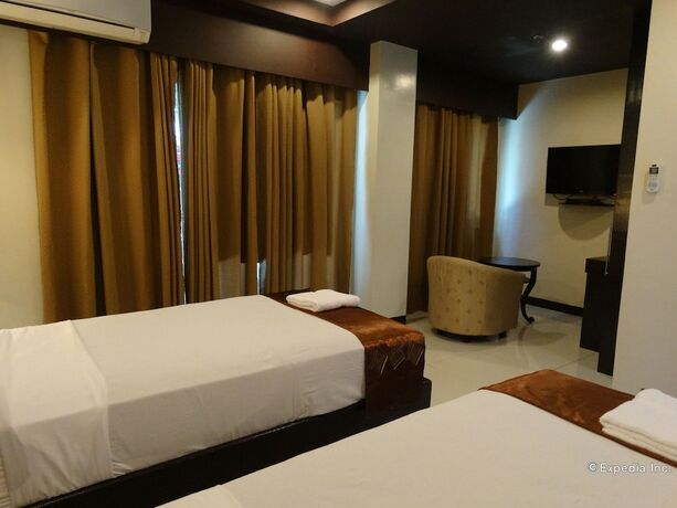 Imagen de la habitación del Hotel The Peridot Suites. Foto 9