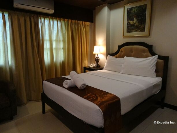 Imagen de la habitación del Hotel The Peridot Suites. Foto 10