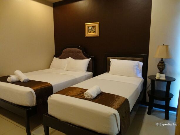 Imagen de la habitación del Hotel The Peridot Suites. Foto 11