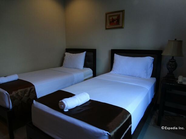 Imagen de la habitación del Hotel The Peridot Suites. Foto 12