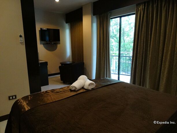 Imagen de la habitación del Hotel The Peridot Suites. Foto 13