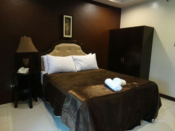 Imagen de la habitación del Hotel The Peridot Suites. Foto 14