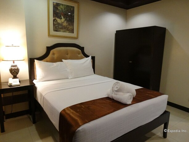 Imagen de la habitación del Hotel The Peridot Suites. Foto 16