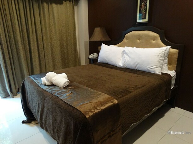 Imagen de la habitación del Hotel The Peridot Suites. Foto 17