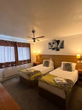 Imagen de la habitación del Hotel The Pheasant Bar and Restaurant. Foto 18