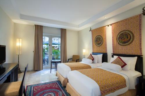 Imagen de la habitación del Hotel The Phoenix Hotel Yogyakarta - Handwritten Collection. Foto 16