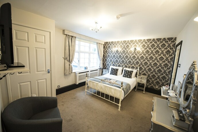 Imagen de la habitación del Hotel The Pied Bull. Foto 16