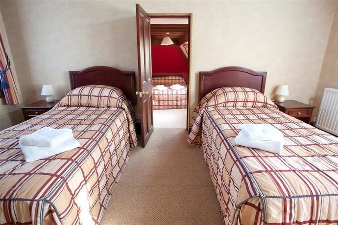 Imagen de la habitación del Hotel The Pilgrims. Foto 8