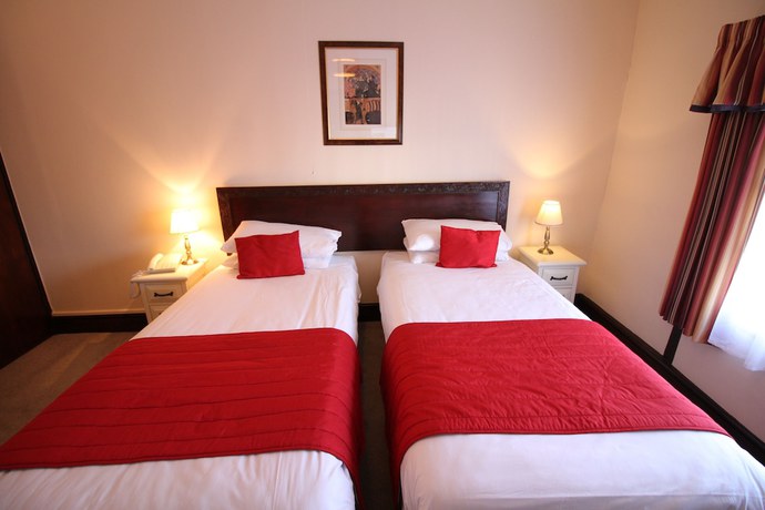 Imagen de la habitación del Hotel The Pilgrims. Foto 11