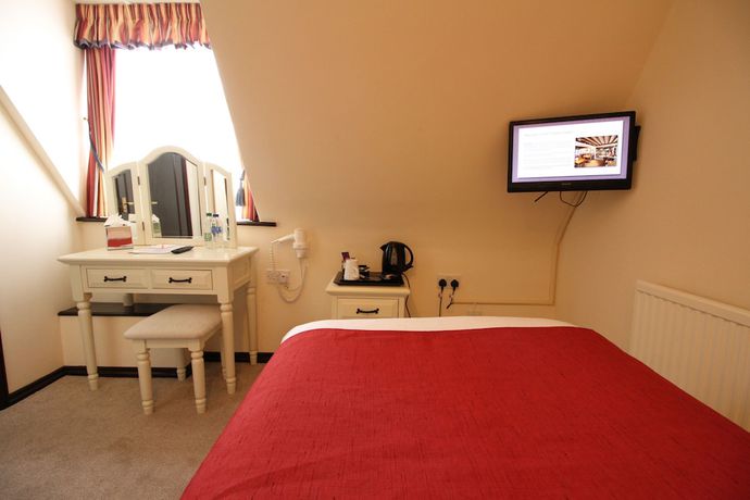 Imagen de la habitación del Hotel The Pilgrims. Foto 13