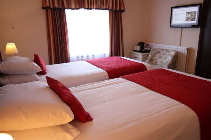 Imagen de la habitación del Hotel The Pilgrims. Foto 14