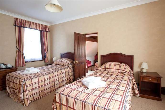 Imagen de la habitación del Hotel The Pilgrims. Foto 17