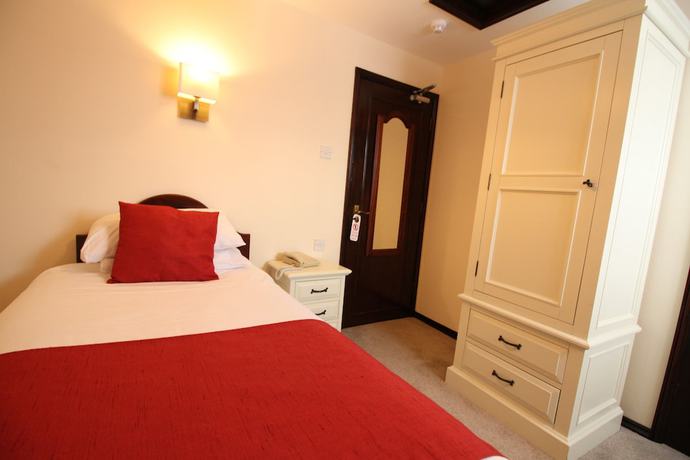 Imagen de la habitación del Hotel The Pilgrims. Foto 19