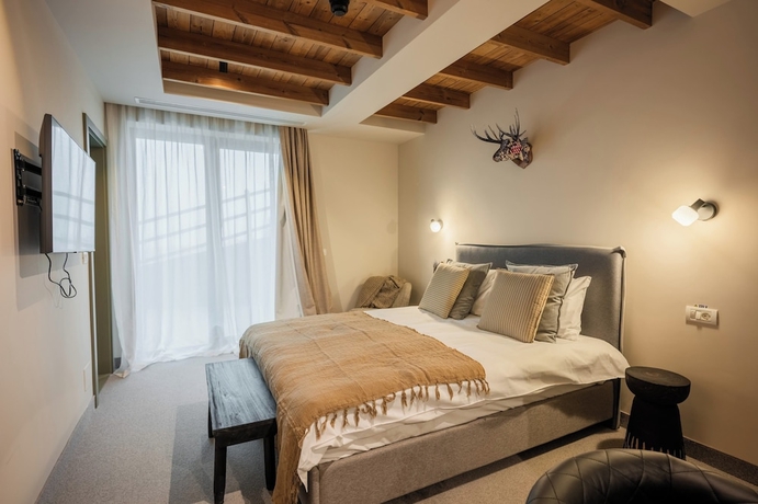 Imagen de la habitación del Hotel The Pines Bucegi Lodge. Foto 5