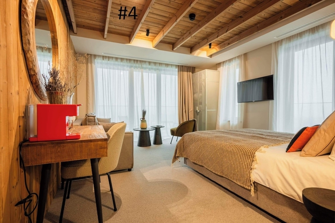 Imagen de la habitación del Hotel The Pines Bucegi Lodge. Foto 6