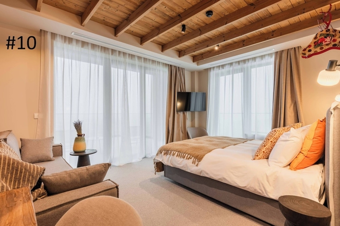 Imagen de la habitación del Hotel The Pines Bucegi Lodge. Foto 7