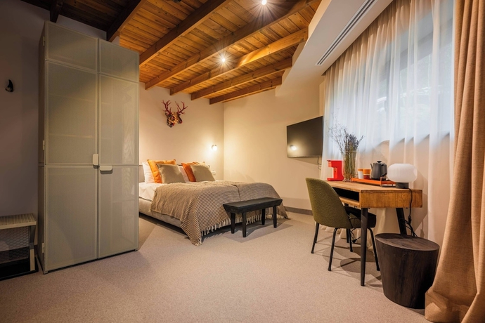 Imagen de la habitación del Hotel The Pines Bucegi Lodge. Foto 10
