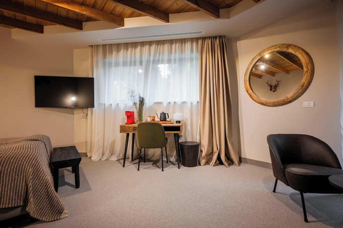 Imagen de la habitación del Hotel The Pines Bucegi Lodge. Foto 13