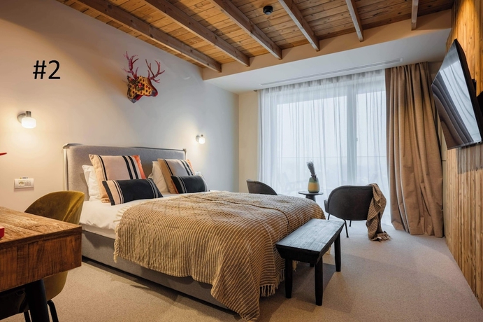 Imagen de la habitación del Hotel The Pines Bucegi Lodge. Foto 16