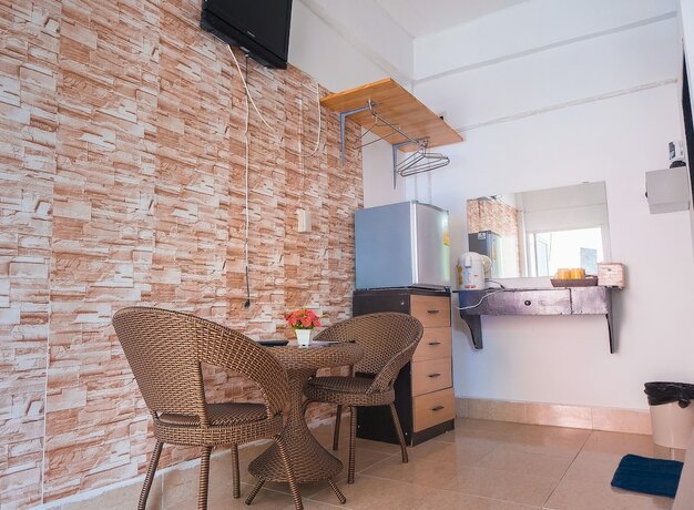 Imagen de la habitación del Hotel The Pink Homes. Foto 15