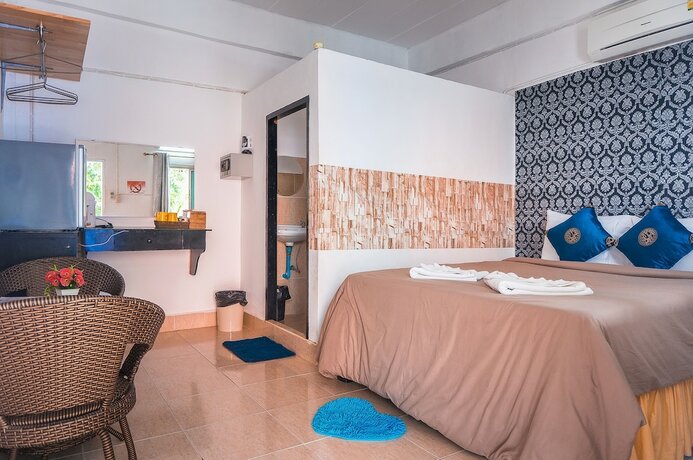 Imagen de la habitación del Hotel The Pink Homes. Foto 16