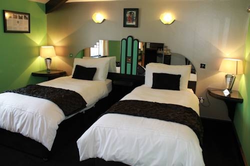 Imagen de la habitación del Hotel The Pitstop. Foto 7