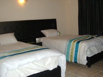 Imagen de la habitación del Hotel The Place Apartments. Foto 13