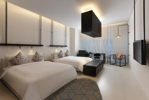 Imagen de la habitación del Hotel The Place Tainan. Foto 8