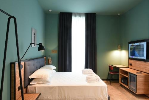 Imagen de la habitación del Hotel The Poet. Foto 8