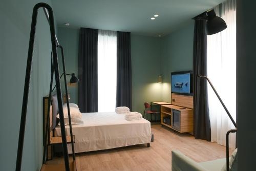 Imagen de la habitación del Hotel The Poet. Foto 10