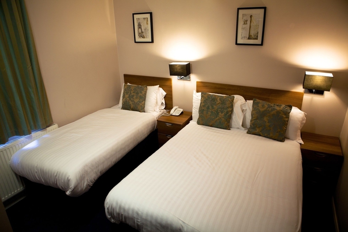 Imagen de la habitación del Hotel The Portico. Foto 5