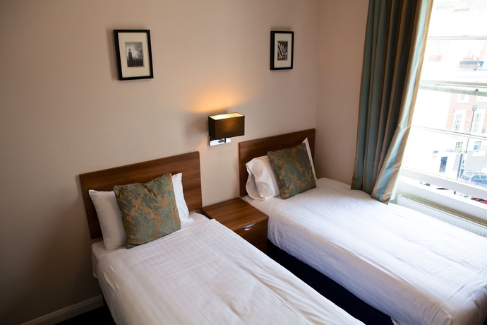 Imagen de la habitación del Hotel The Portico. Foto 9