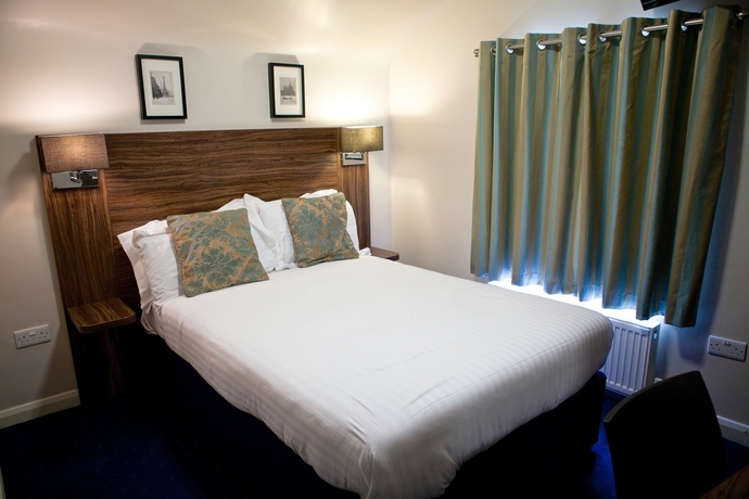 Imagen de la habitación del Hotel The Portico. Foto 10