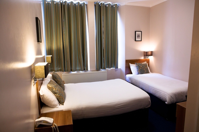 Imagen de la habitación del Hotel The Portico. Foto 11