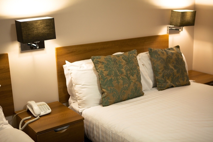 Imagen de la habitación del Hotel The Portico. Foto 14