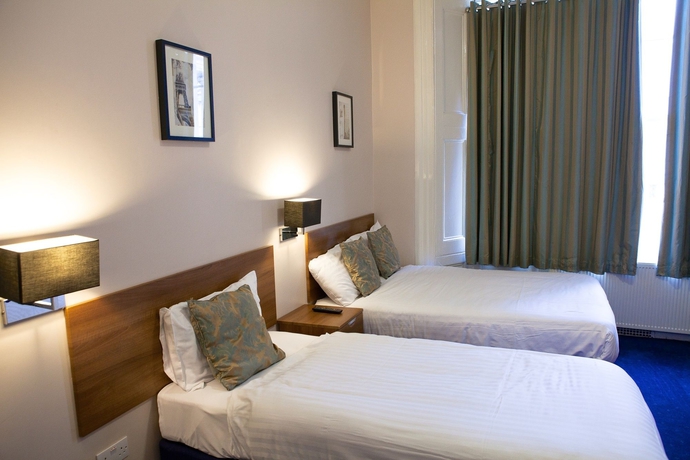 Imagen de la habitación del Hotel The Portico. Foto 16