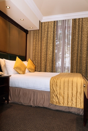 Imagen de la habitación del Hotel The Premier Notting Hill. Foto 12