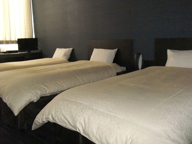 Imagen de la habitación del Hotel The Premium In Rinku. Foto 4